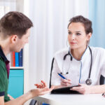 29189558 — doctor talking with patient and taking notes